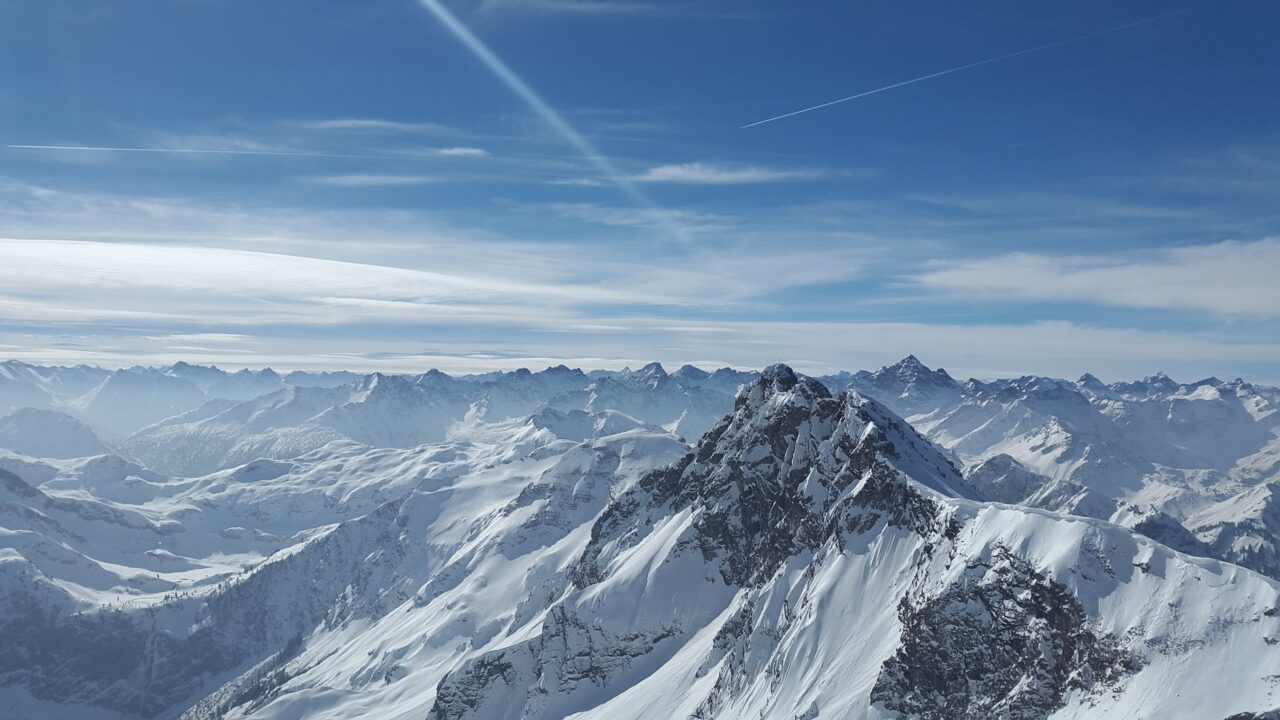 bird s eye view of snow coated mountains